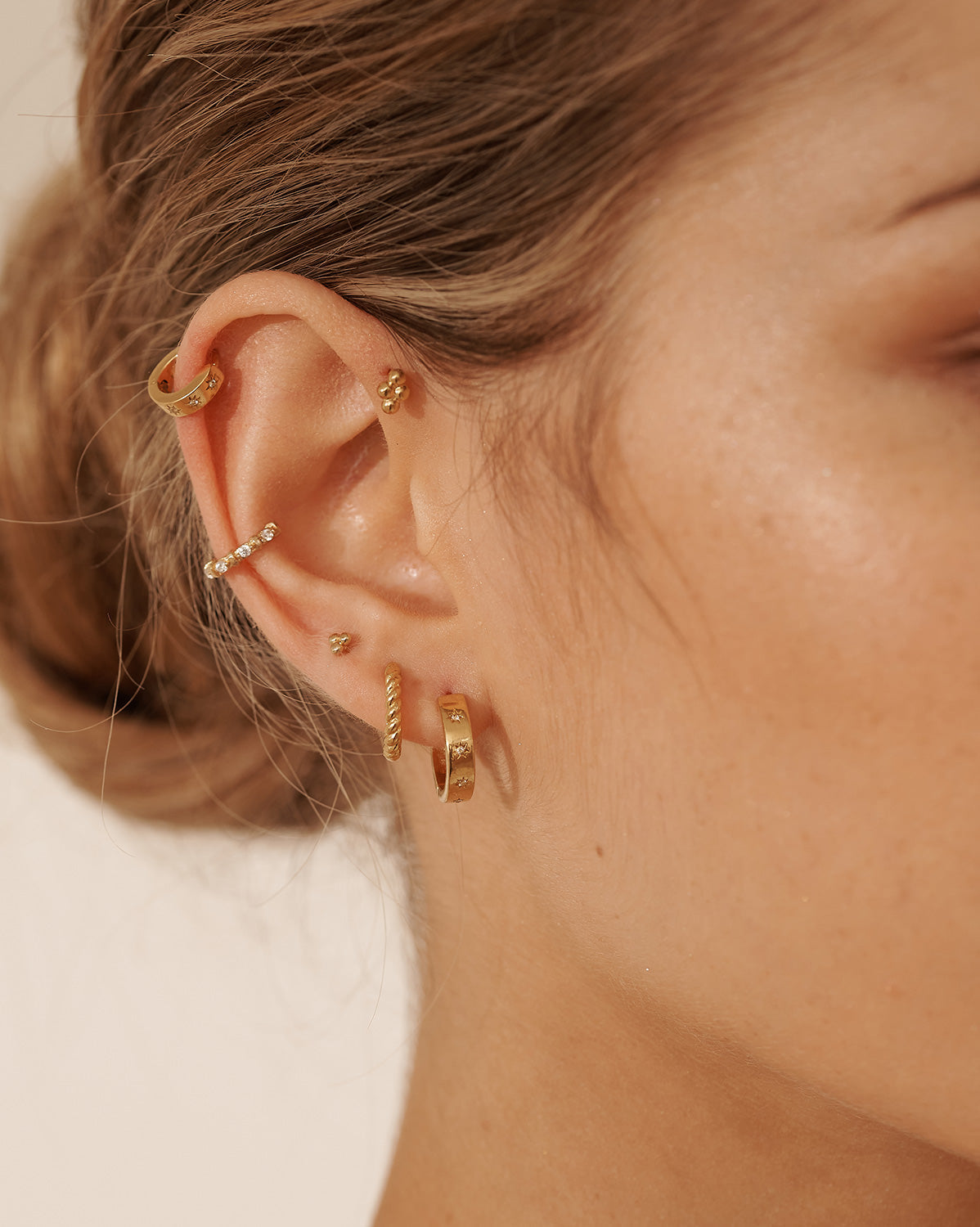 14K Solid Gold Bella Twist Huggie Hoops | S-kin Studio Jewelry | Ethical Piercing Earrings